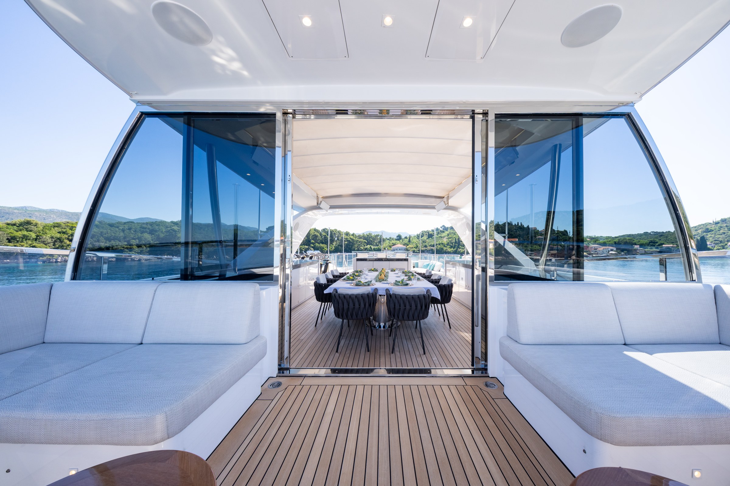 HAPPY ME — Spacious aft deck lounge with white and blue cushions