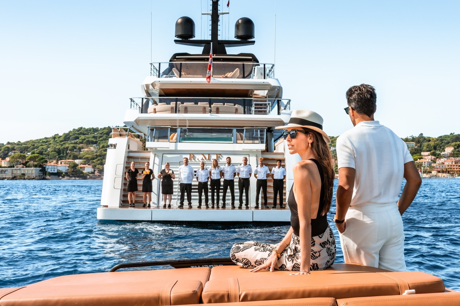 R.M.F crew lined up on the swim platform welcoming guests