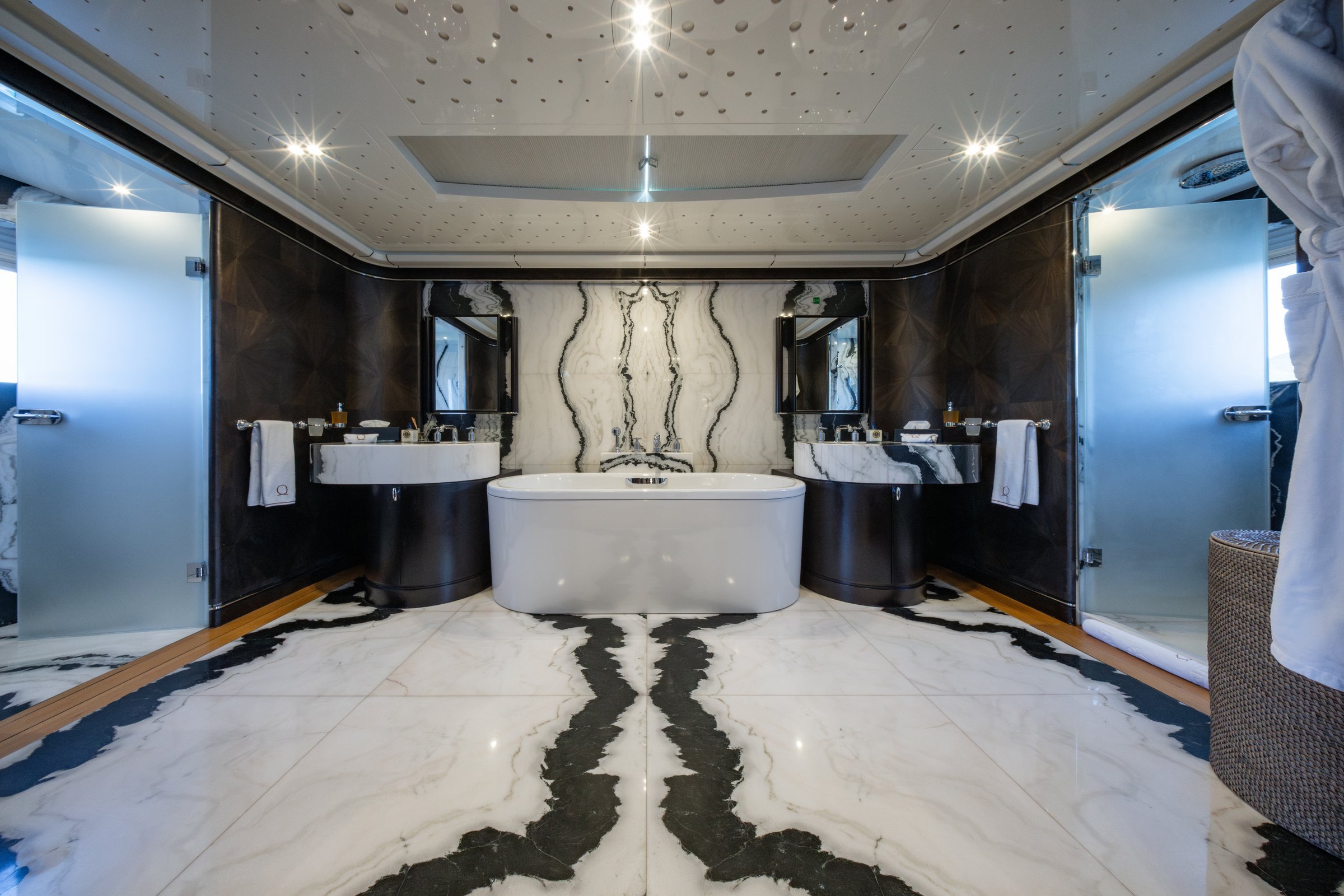 Master bathroom of AQUARIUS with freestanding bath and book-matched marble