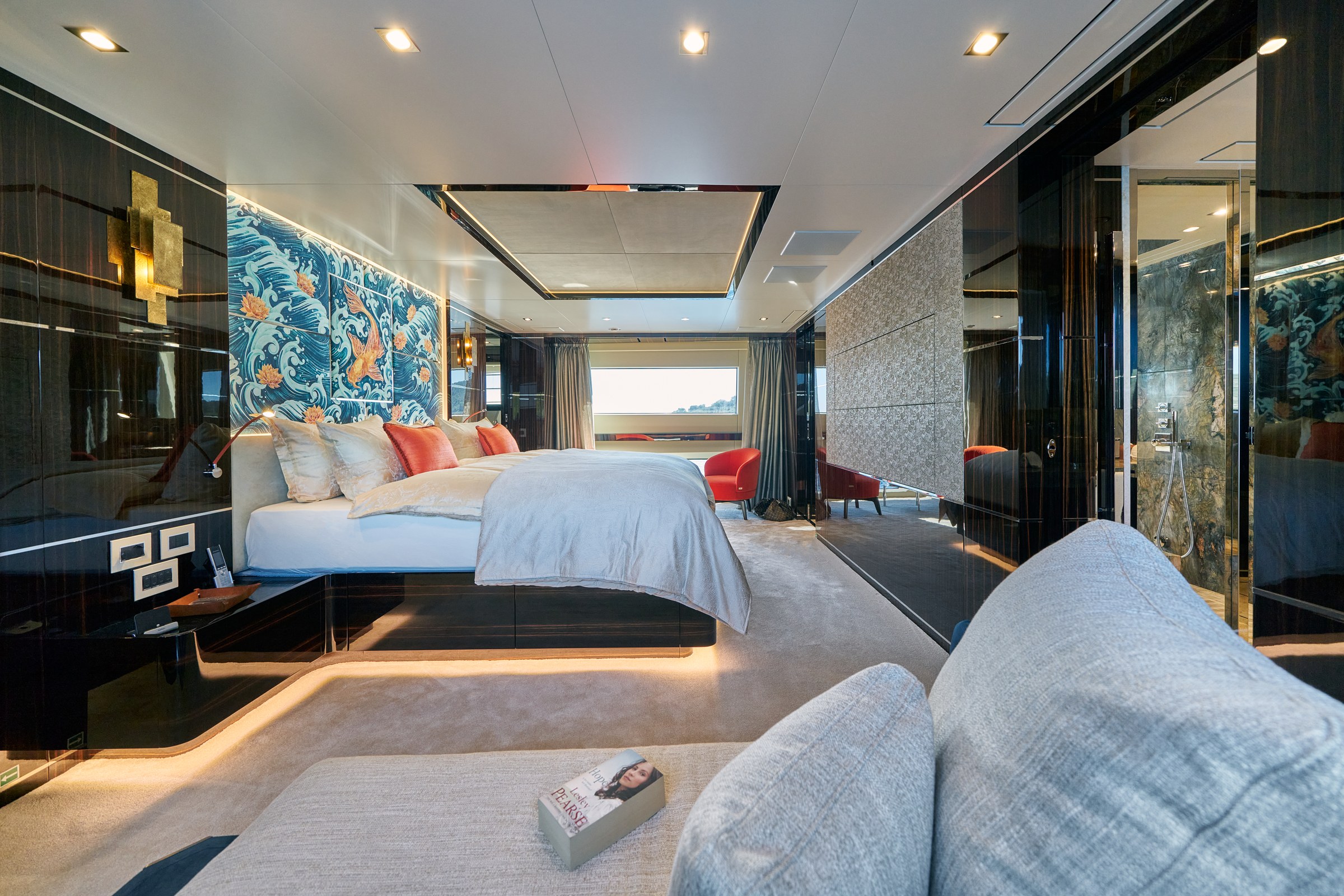 HAPPY ME — Master stateroom with patterned headboard and sea views