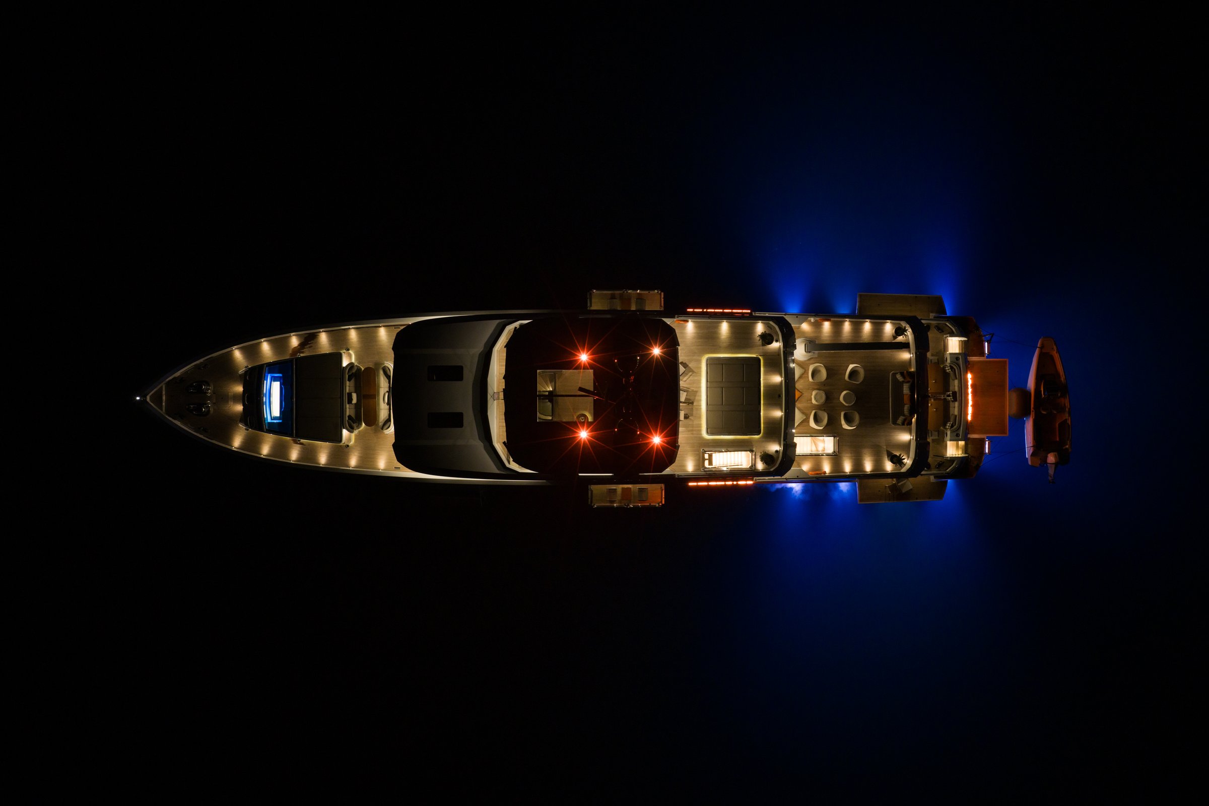 AQUARIUS lit at night from above with underwater lights on
