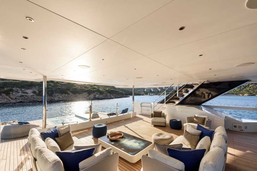 LEGASEA — Shaded aft deck seating at golden hour