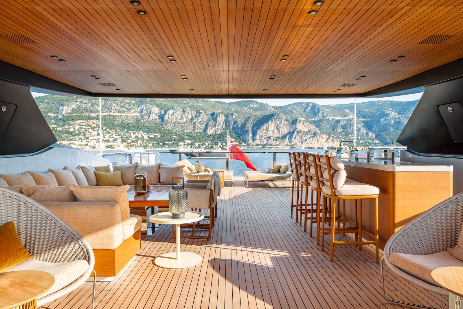 R.M.F covered aft lounge with bar stools overlooking the coast