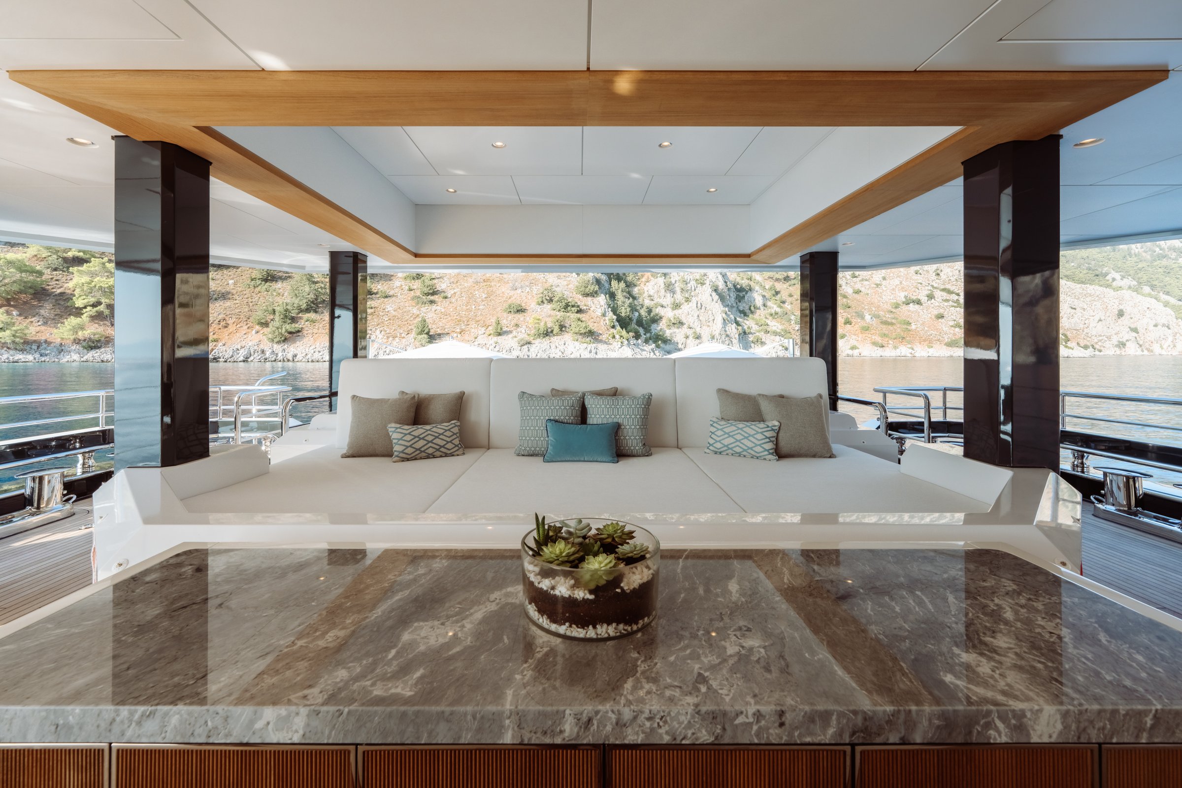 AFTER YOU — Main deck sunpad lounge with coastal views