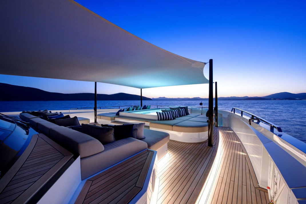 LEGASEA — Foredeck Jacuzzi and sun lounge at twilight