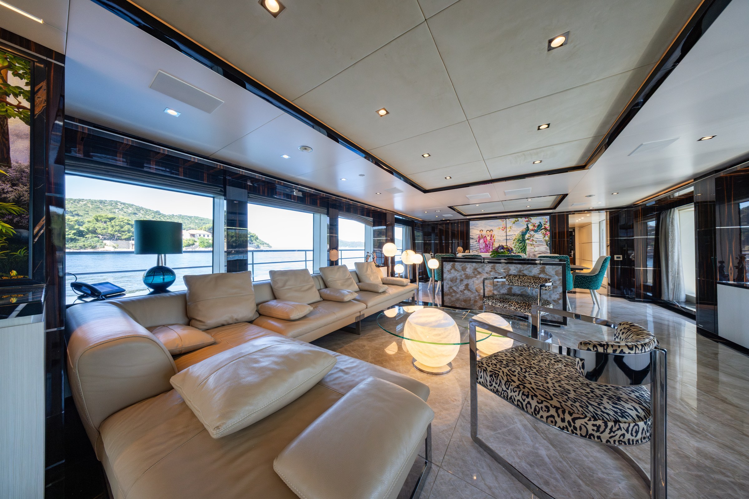 HAPPY ME — Bright main salon with contemporary seating and large windows