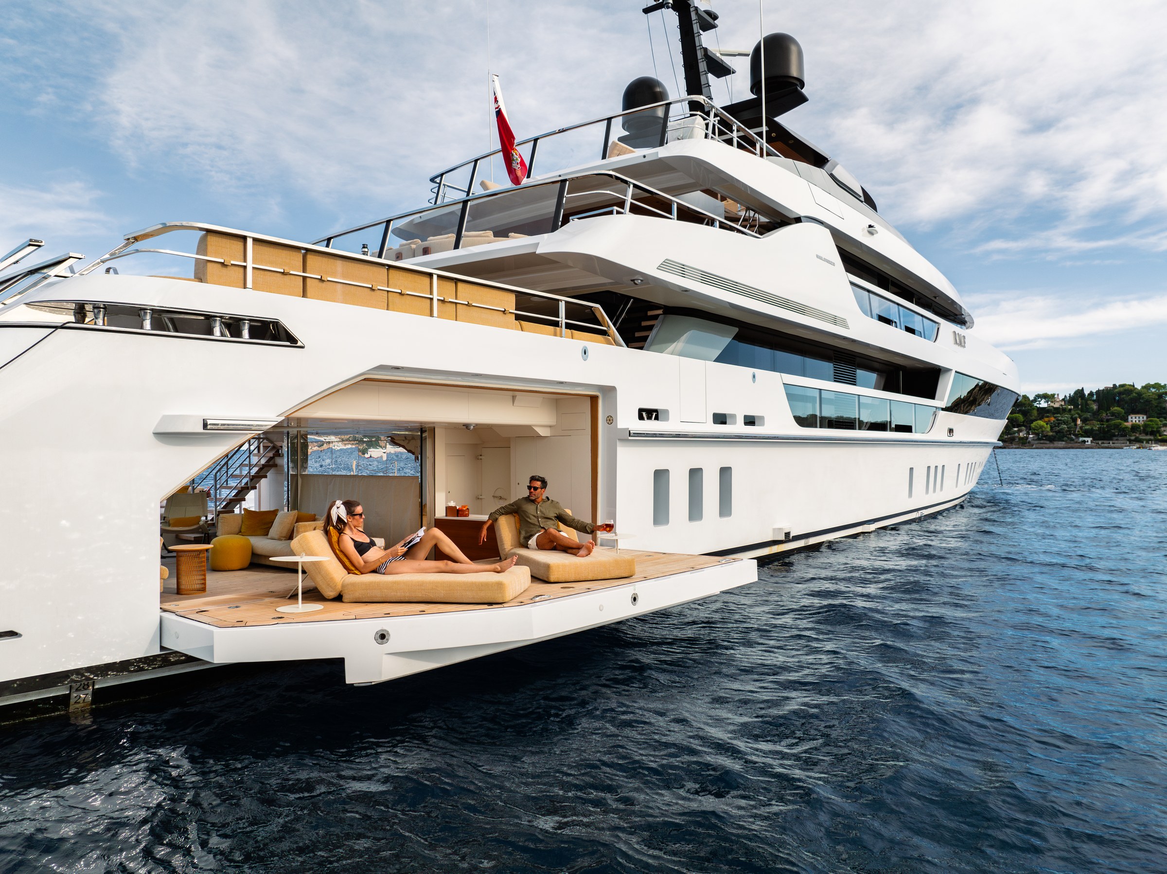 R.M.F fold-out beach club terrace with guests at water level