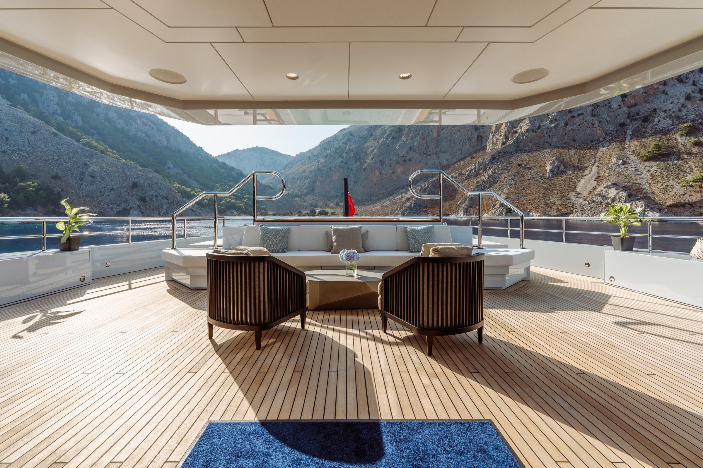 AFTER YOU — Aft deck lounge overlooking rocky coastline