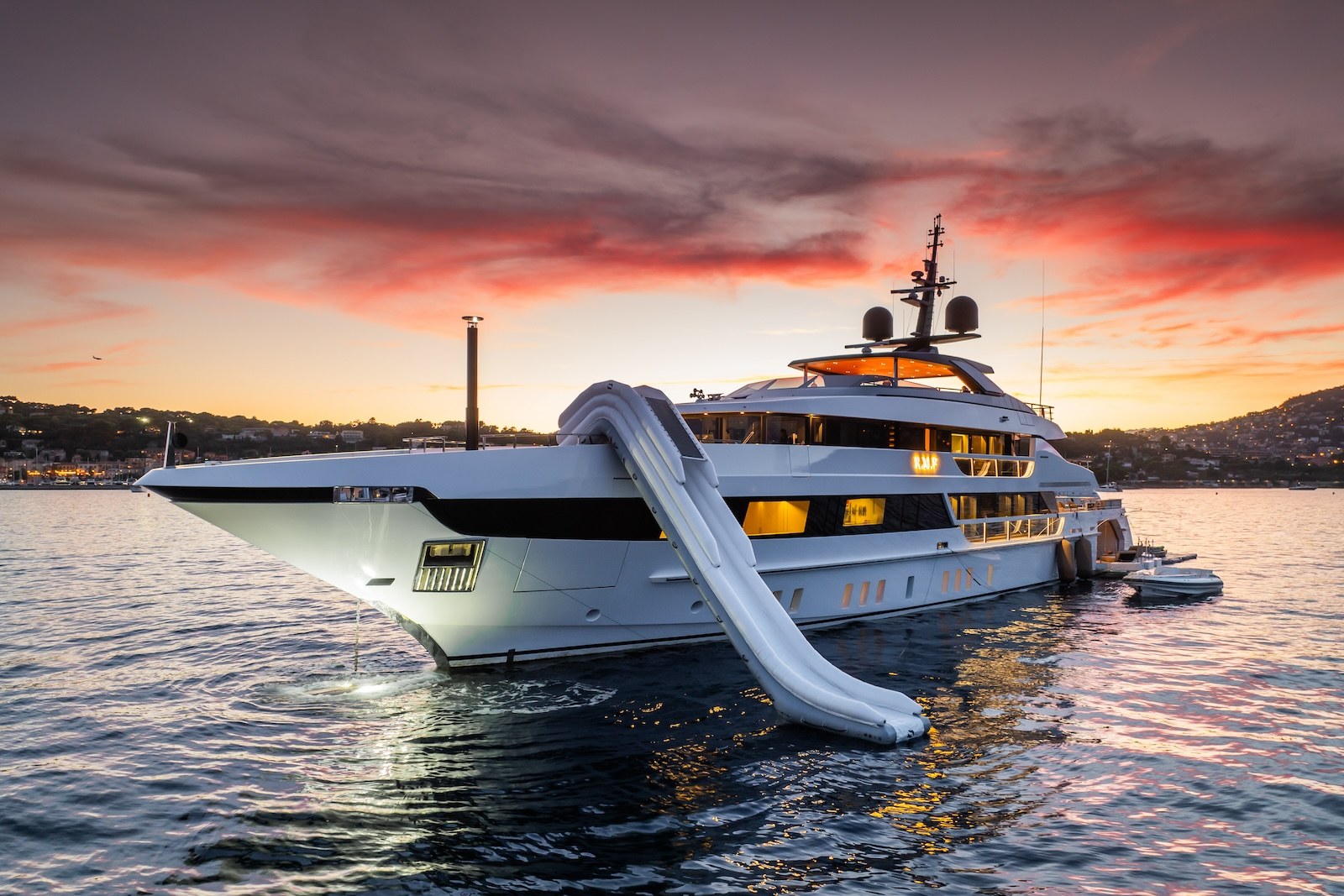 R.M.F at anchor at sunset with inflatable water slide deployed