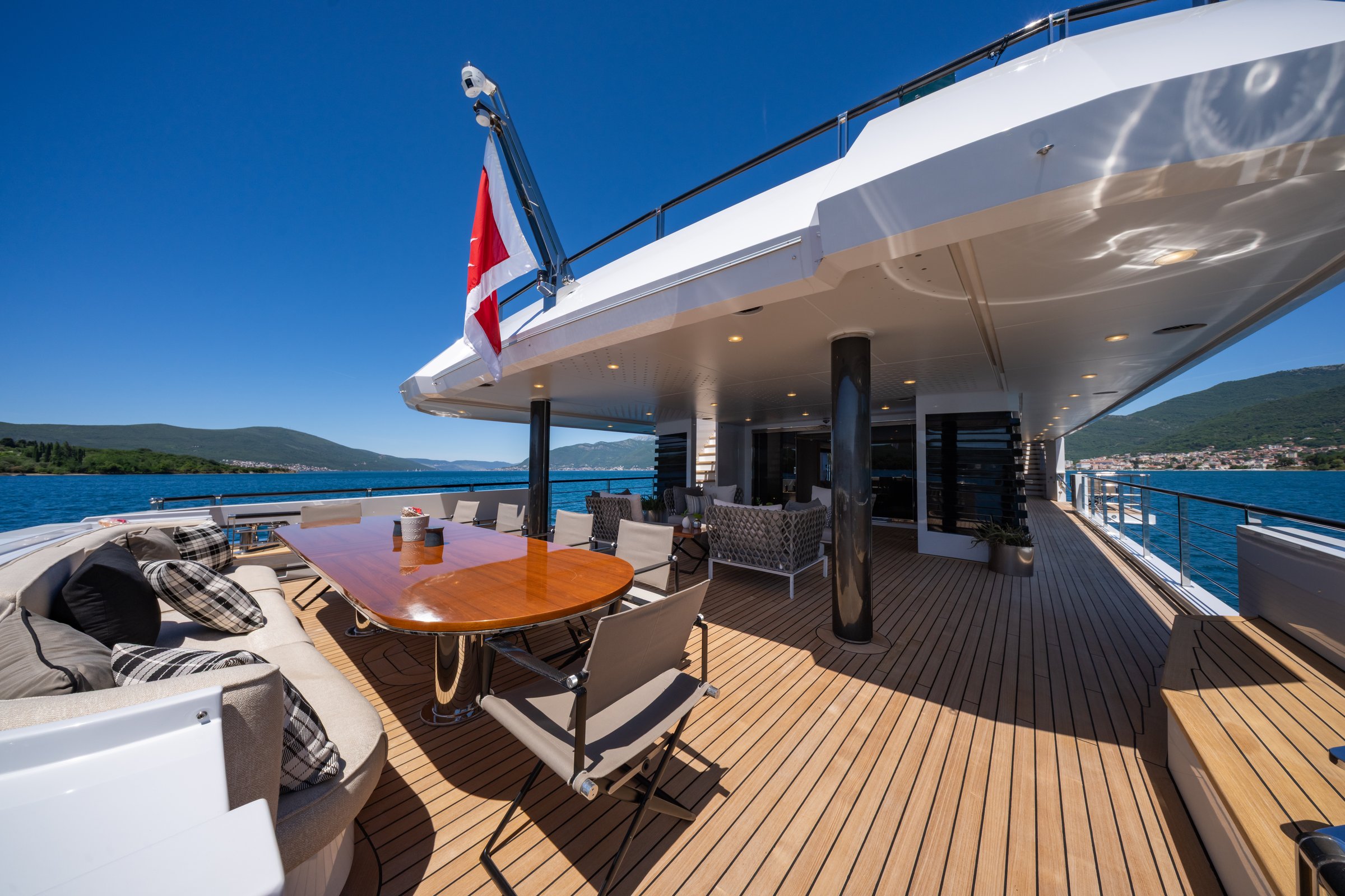 Alfresco dining table on the deck of AQUARIUS under the Turkish flag