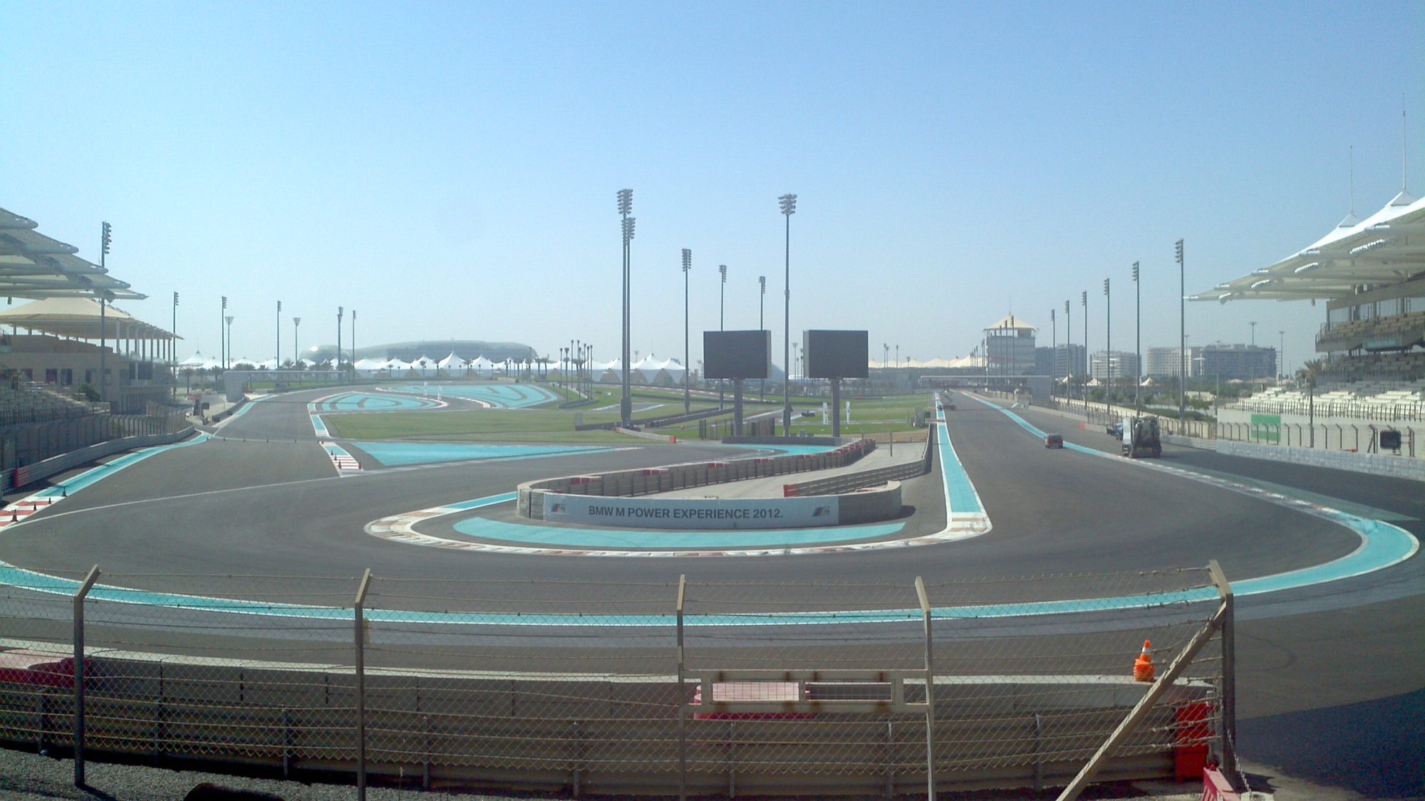 Aerial view of Yas Marina Circuit, the marina and the hotel over the track