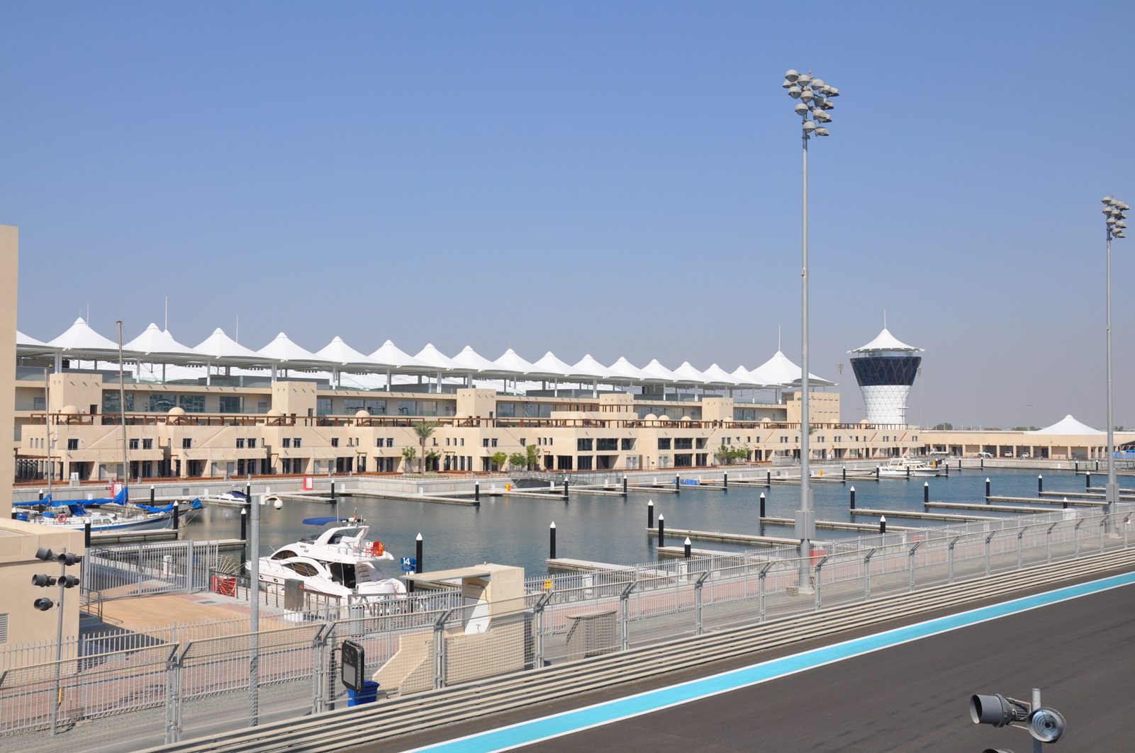 Yachts berthed beside Yas Marina Circuit, with the hotel beyond