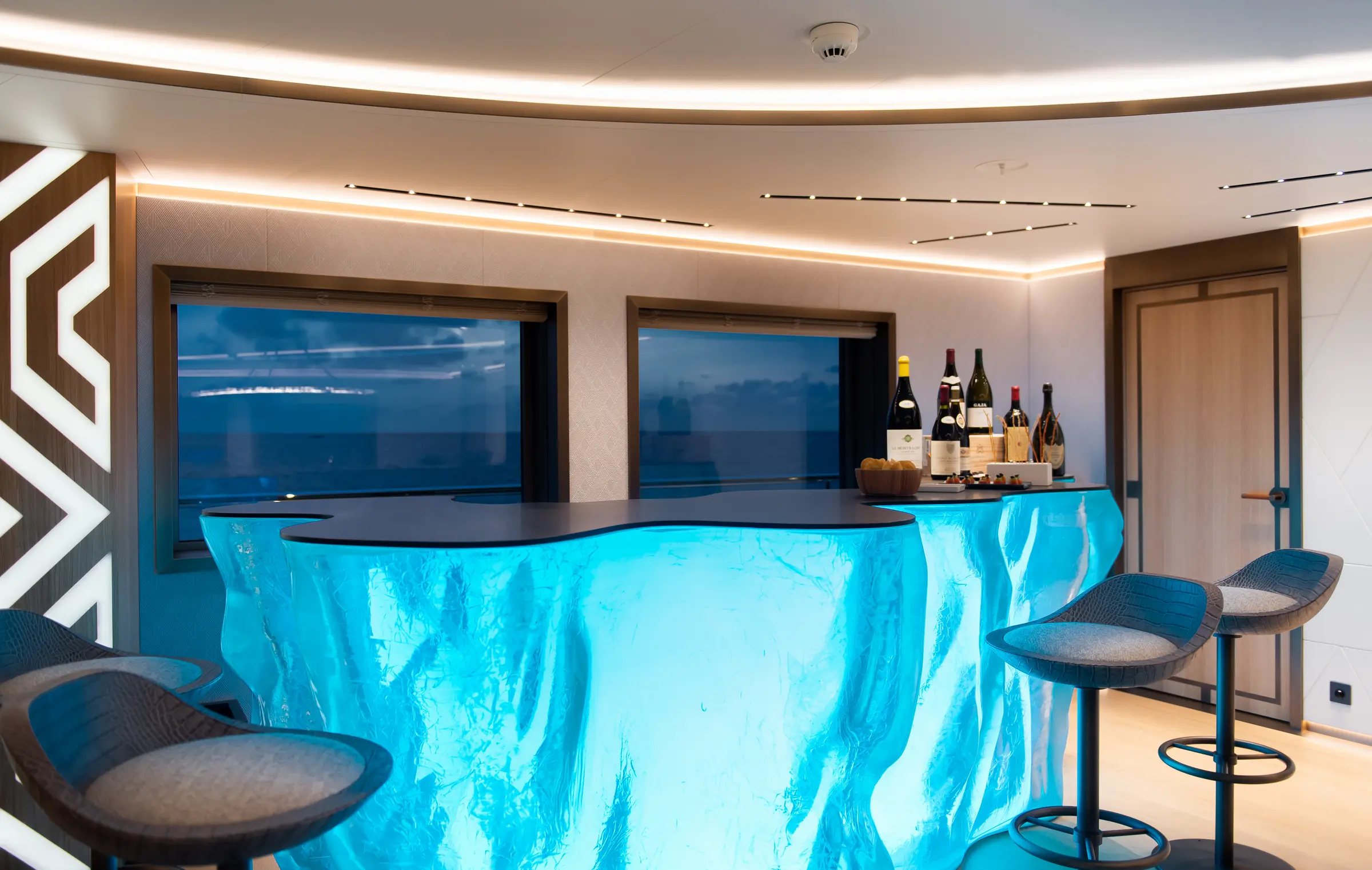 Blue illuminated onyx bar inside LA DATCHA
