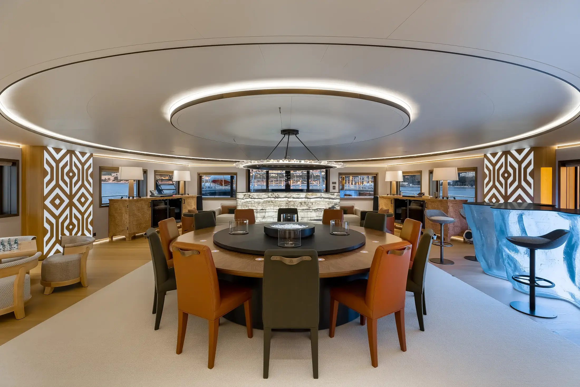 Circular dining table and salon seating aboard LA DATCHA