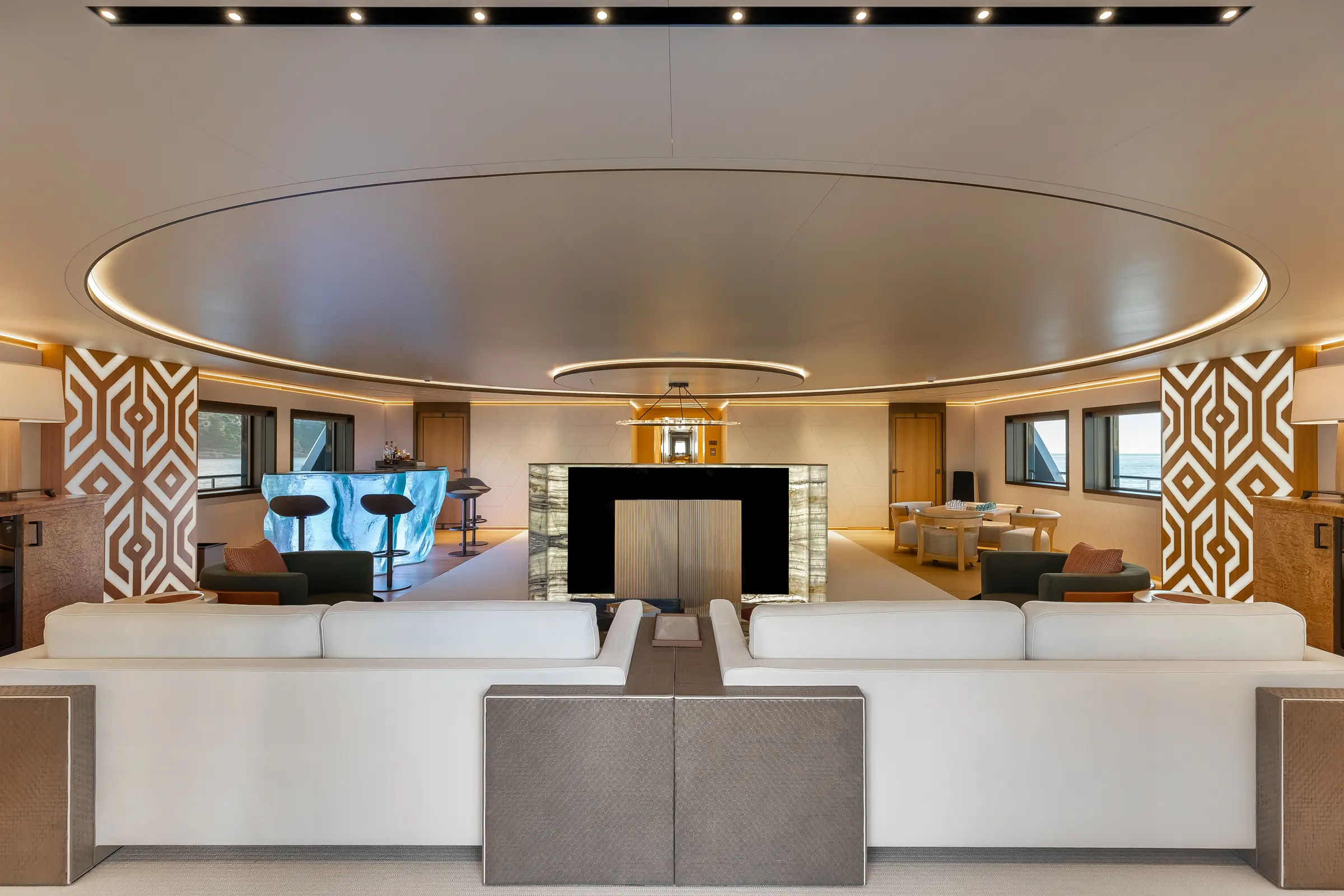 Wide view across LA DATCHA's main salon seating and illuminated bar