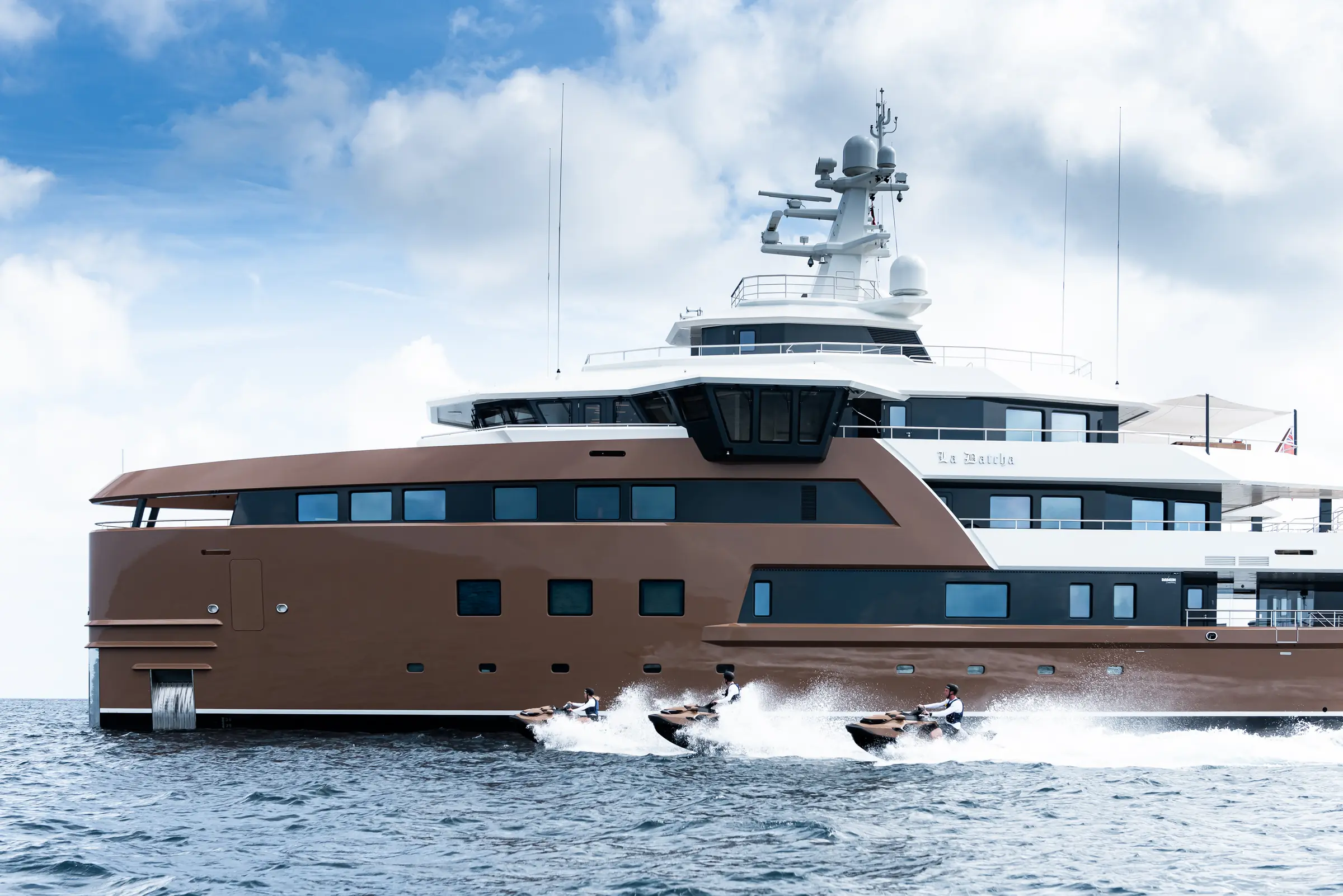 LA DATCHA broadside with personal watercraft running alongside