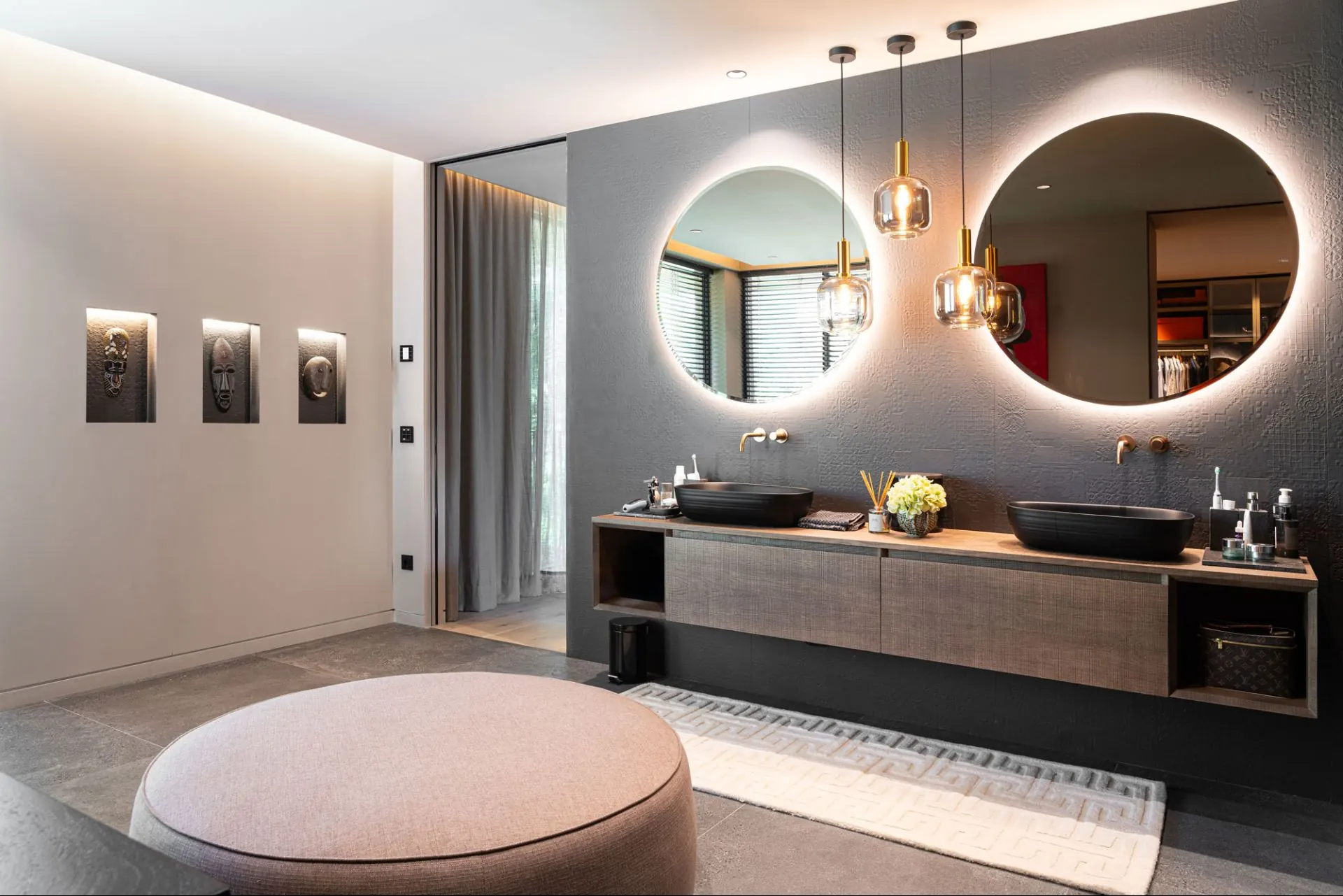 A bathroom in the Cala Vinyas villa, with a double vanity and wide mirror